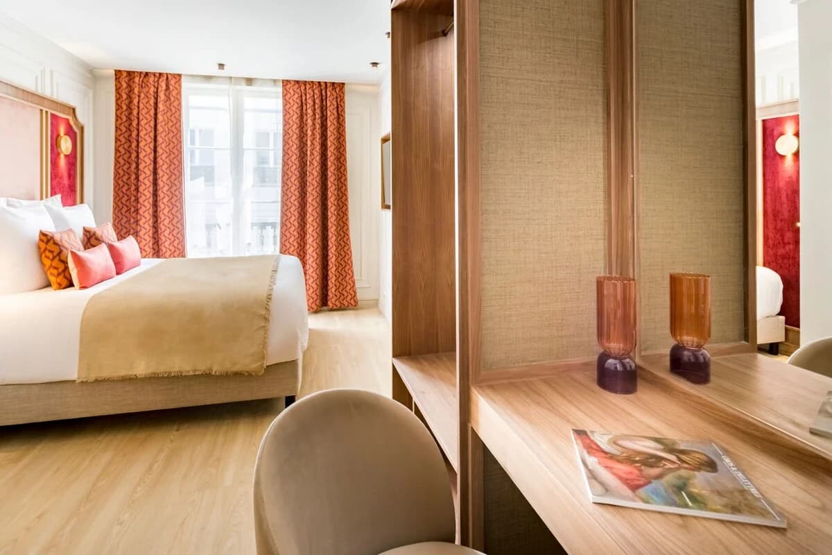 Bedroom corner with red drapes, panelled walls and walnut desk