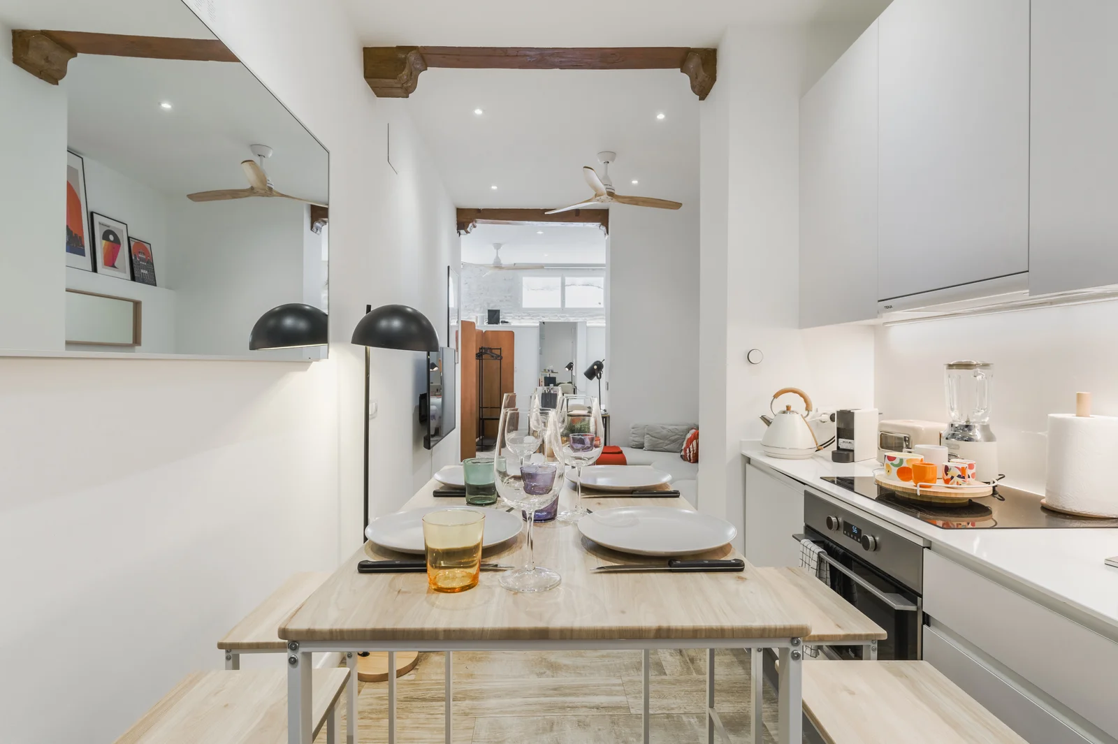 Slim dining bar set under exposed beams with city loft feel