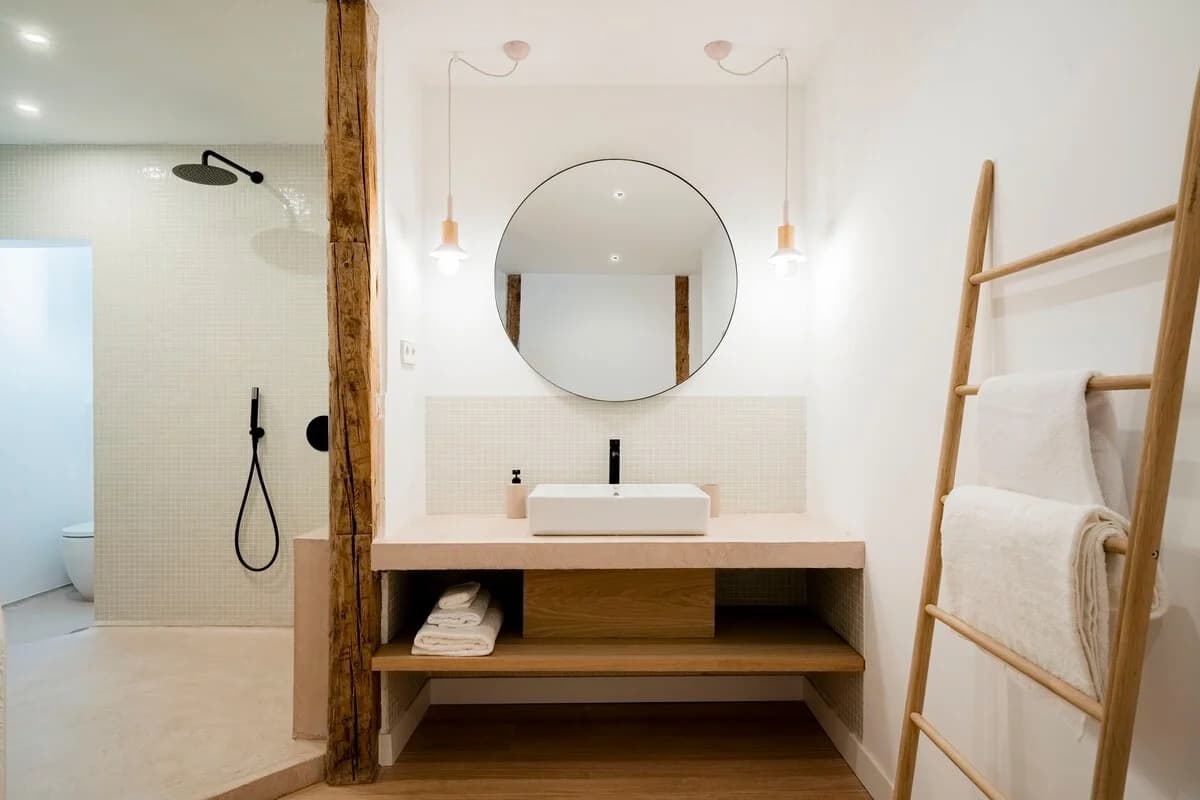 Bathroom vanity with mosaic tile splash and timber ladder towel rack