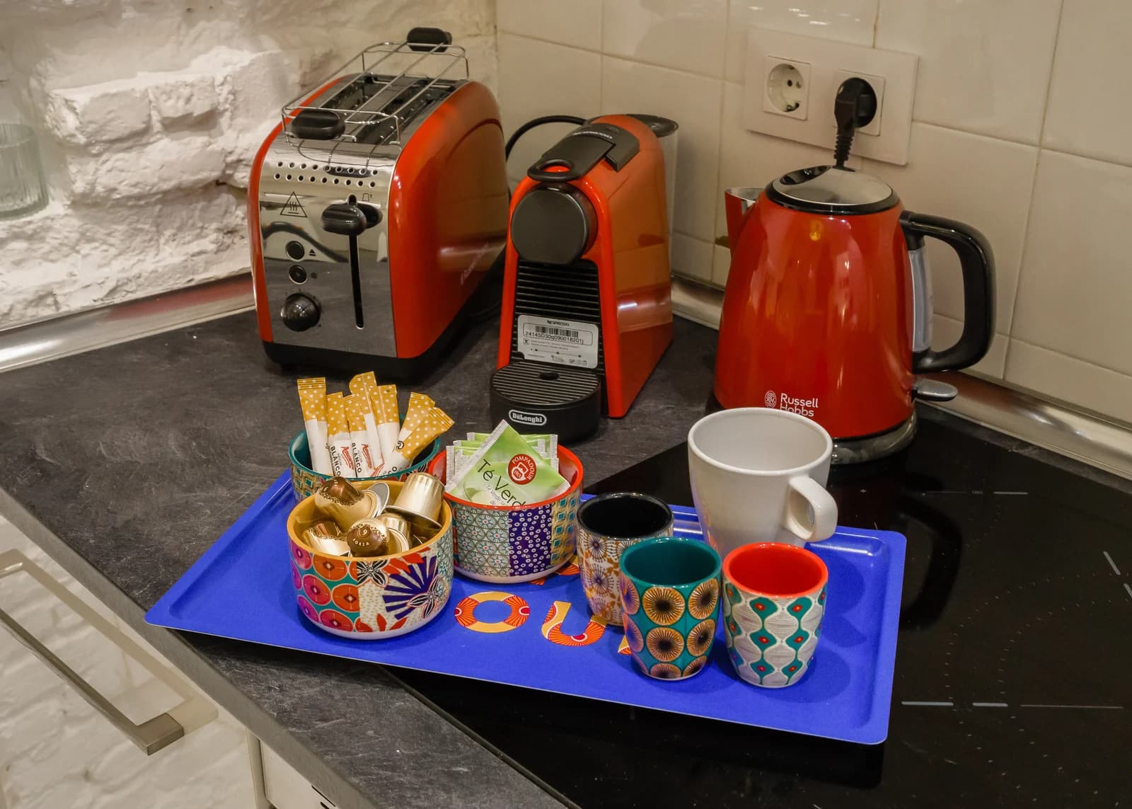 Welcome tray with red Russell Hobbs kettle, Nespresso and patterned mugs