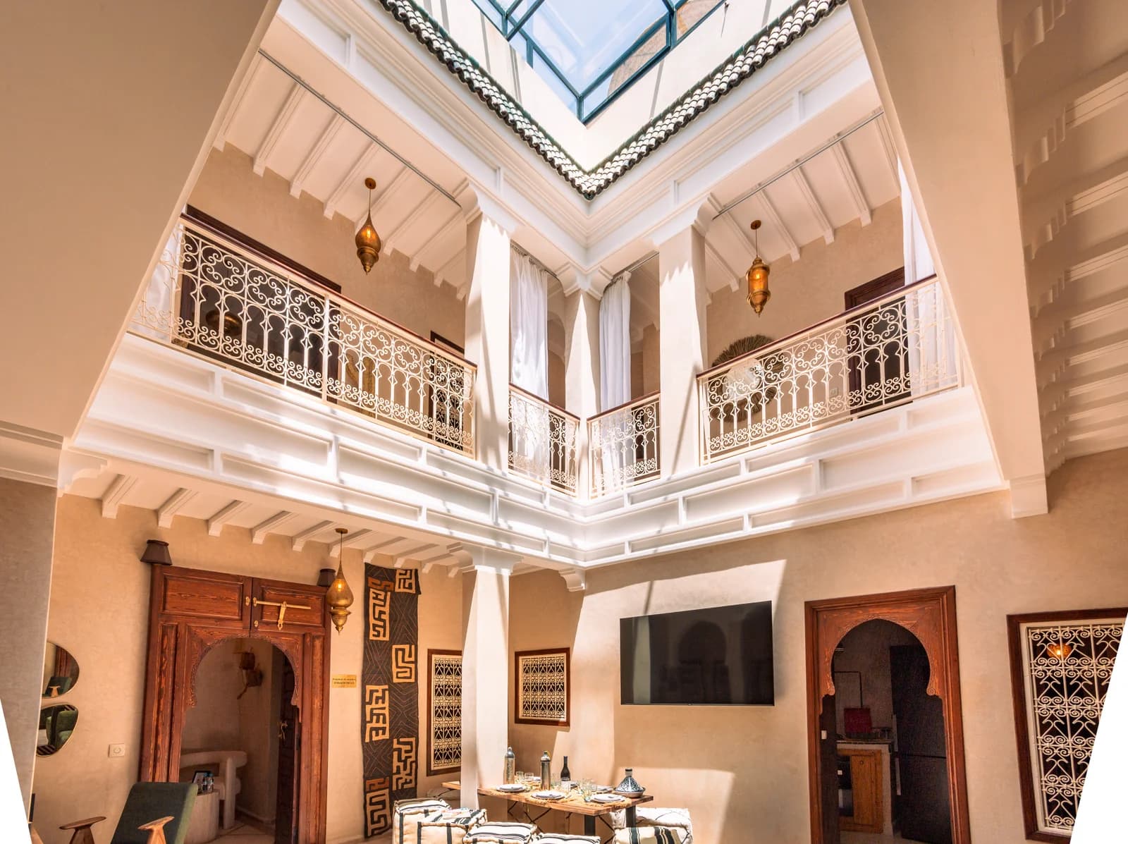 Vertical atrium soaring to glass skylight with iron balustrades and lanterns