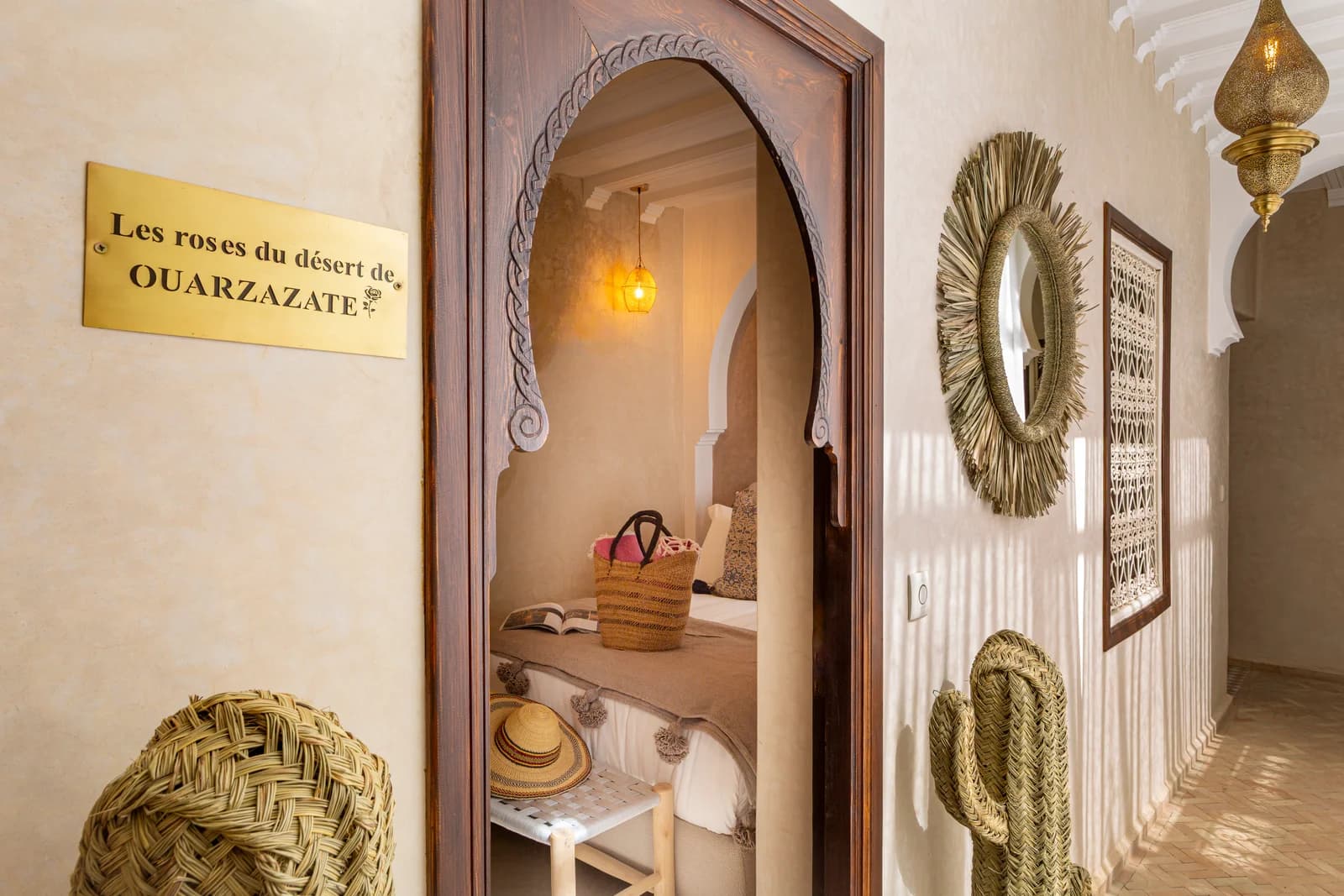Carved keyhole archway leading to the Ouarzazate bedroom suite