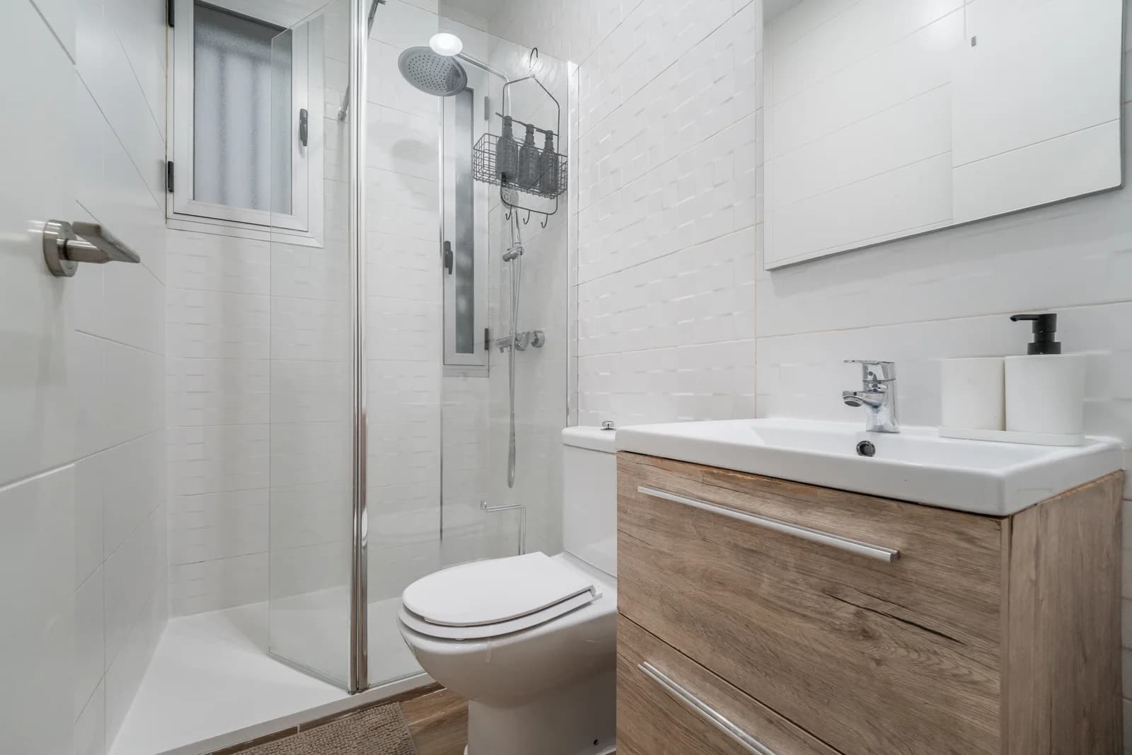 Bright bathroom with timber vanity and glass-enclosed rain shower