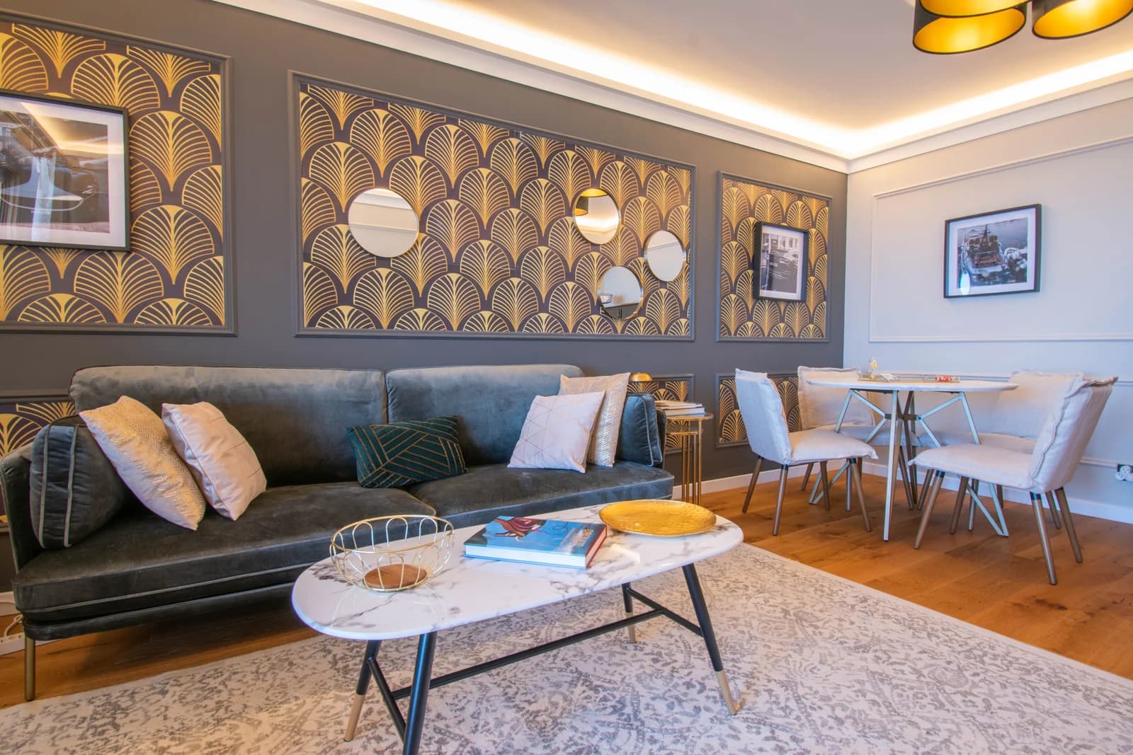 Living-dining combo with deco panels and gold pendant lighting