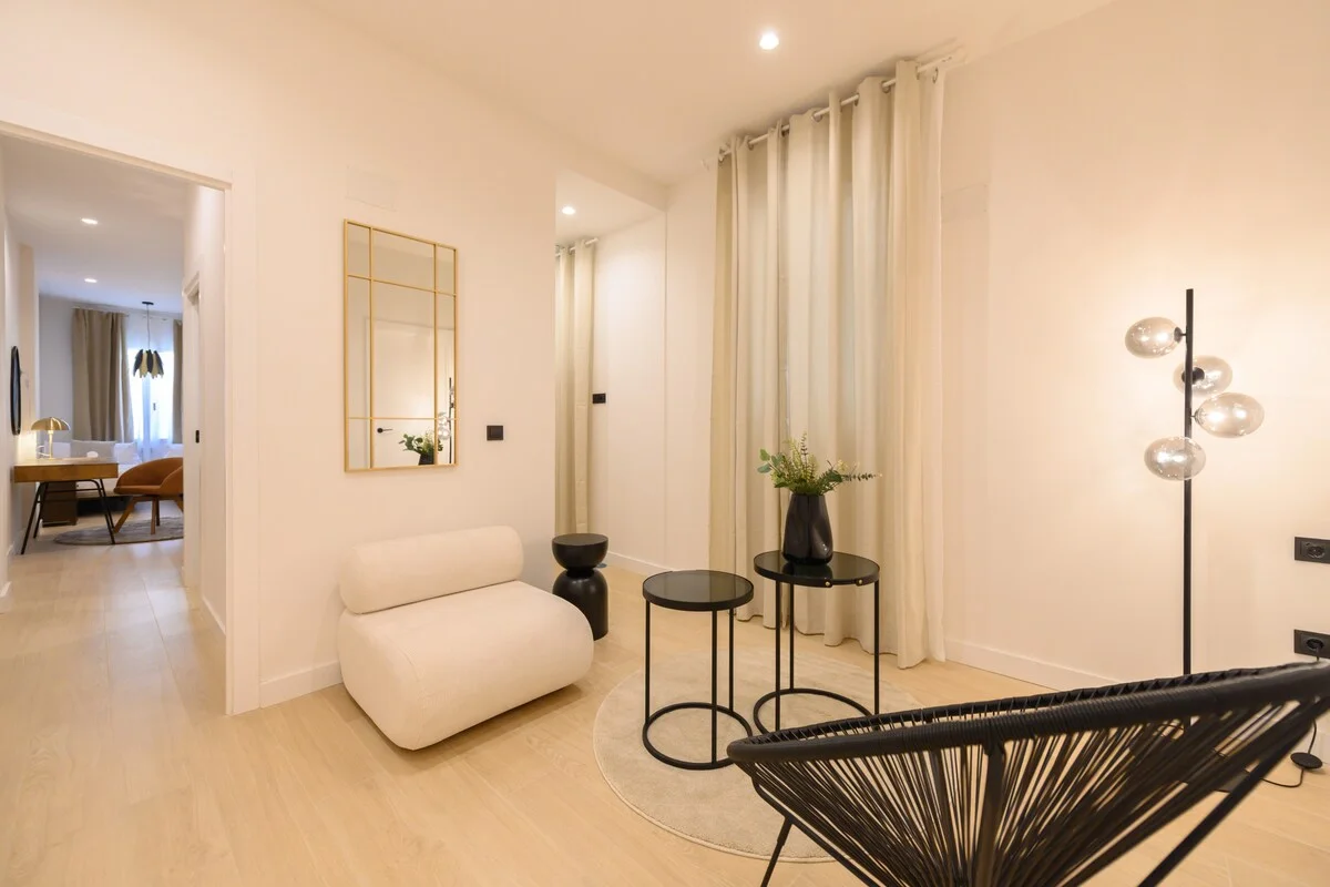 Hall-lounge with bouclé chair and globe-cluster floor lamp