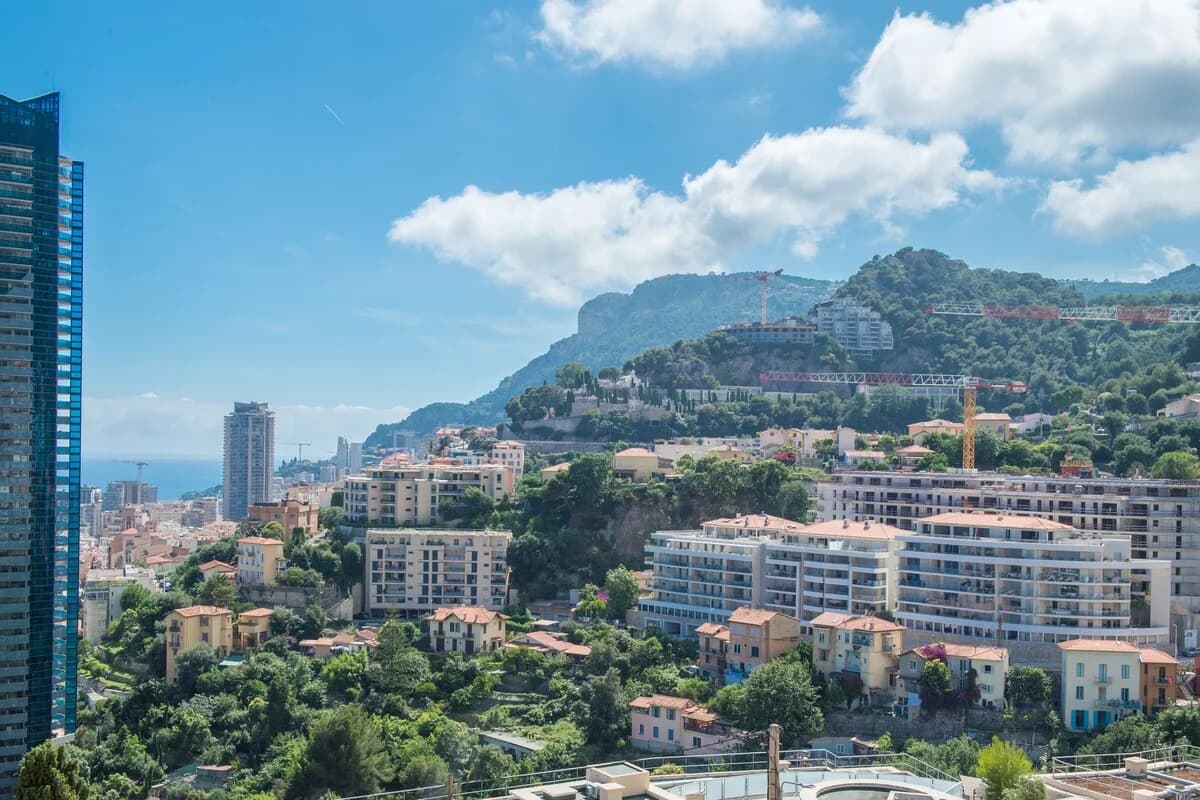 View of Monaco hillside, harbour and rooftops from apartment