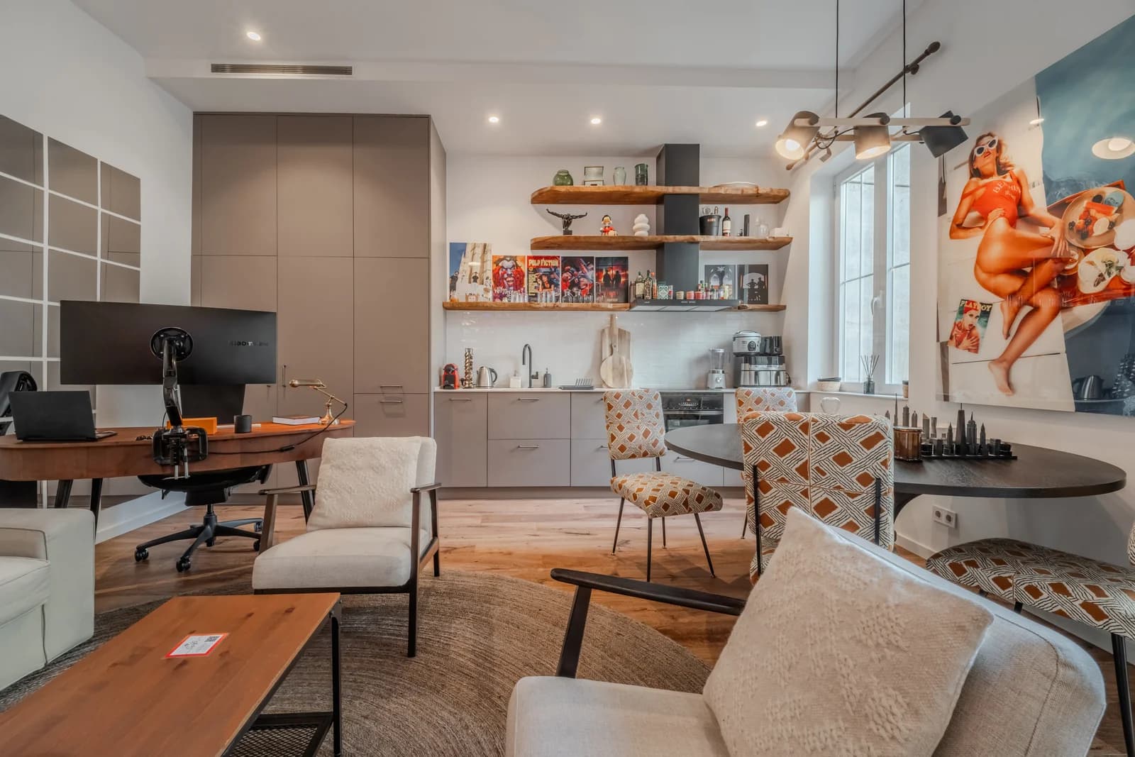Open kitchen with floating walnut shelves and pop-art canvas