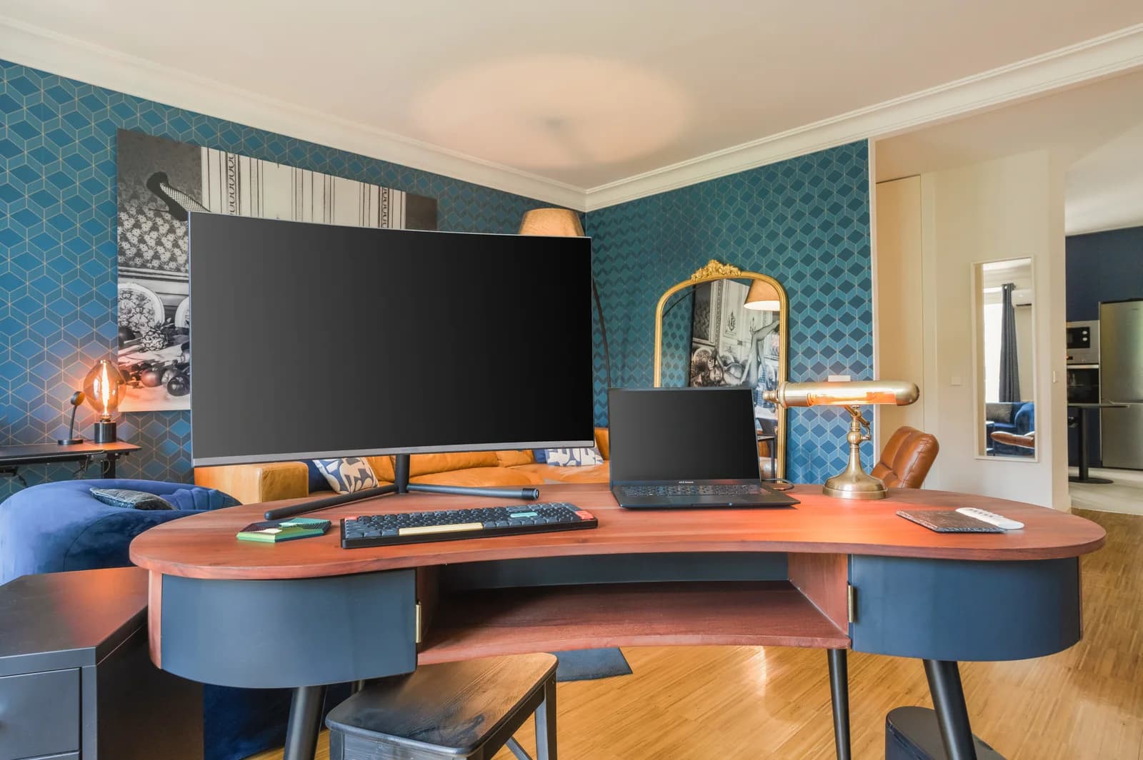 Curved workstation with twin monitors against deep blue wallpaper