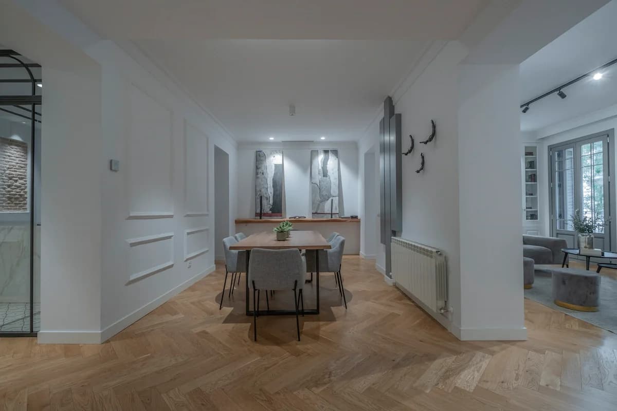 Dining table with art panels and view through to living room